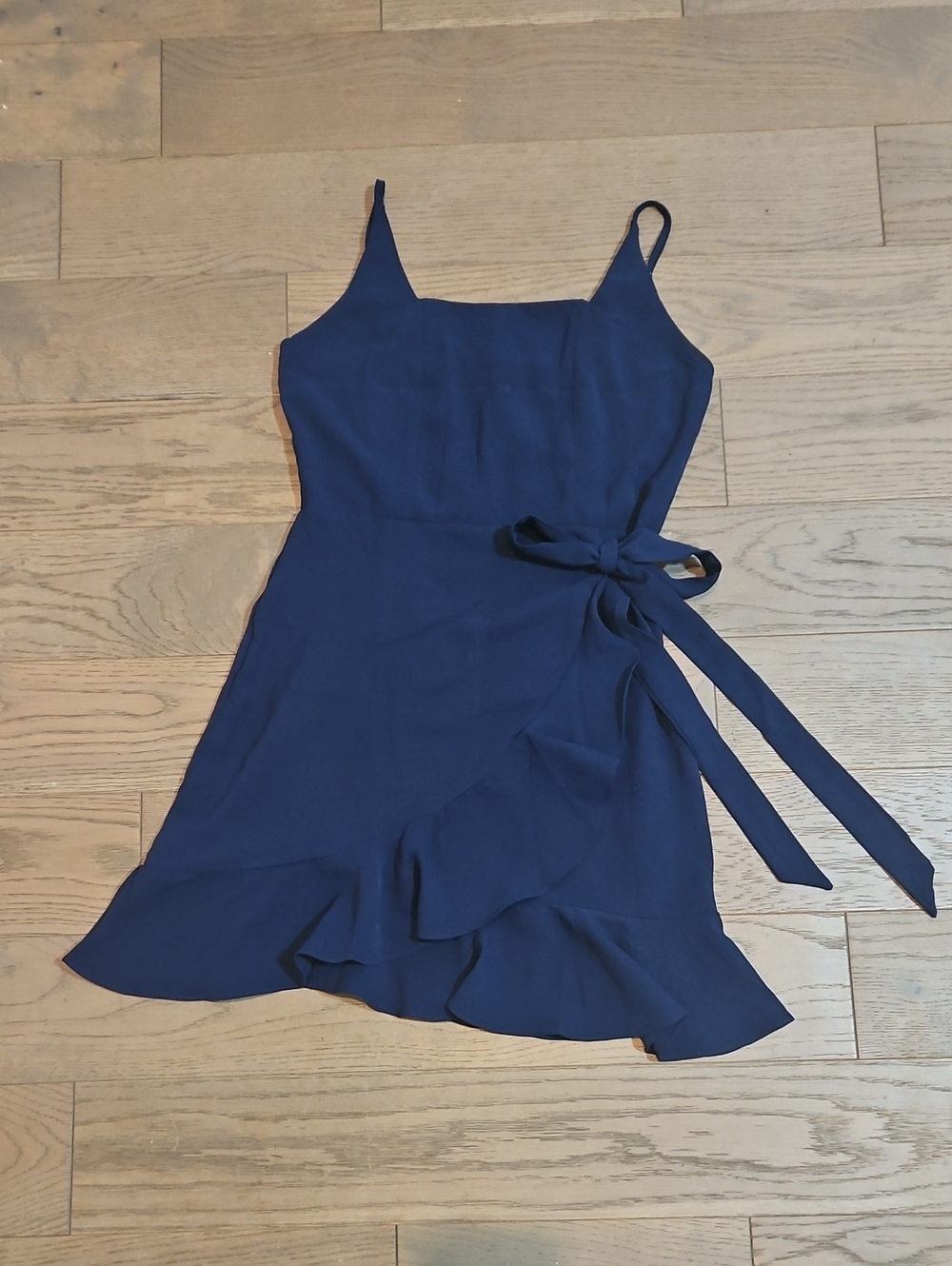 Navy Sleeveless Dress with Ruffle Hem And Wrap Detail